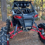 Load image into Gallery viewer, Polaris RZR 900 snorkel kit installed, featuring durable hoses and fittings for water crossing protection, designed for 2021-2025 models.
